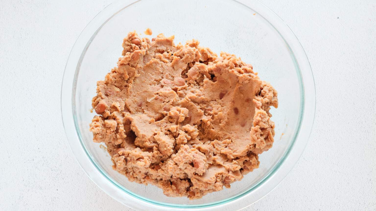 refried beans in clear bowl