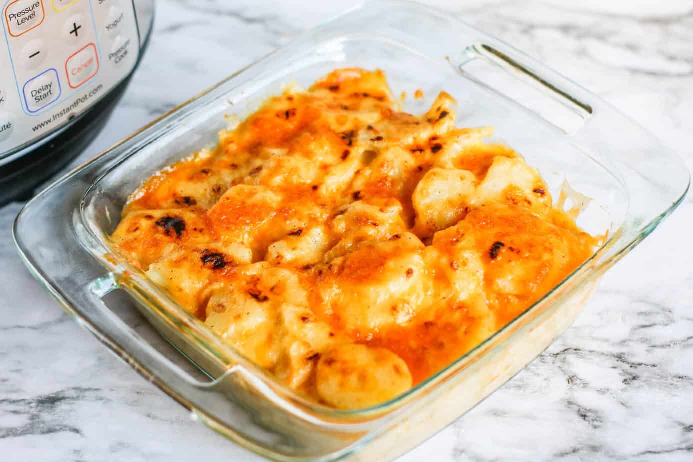 Instant Pot Au Gratin Potatoes Recipe with browned bubbly cheese on top