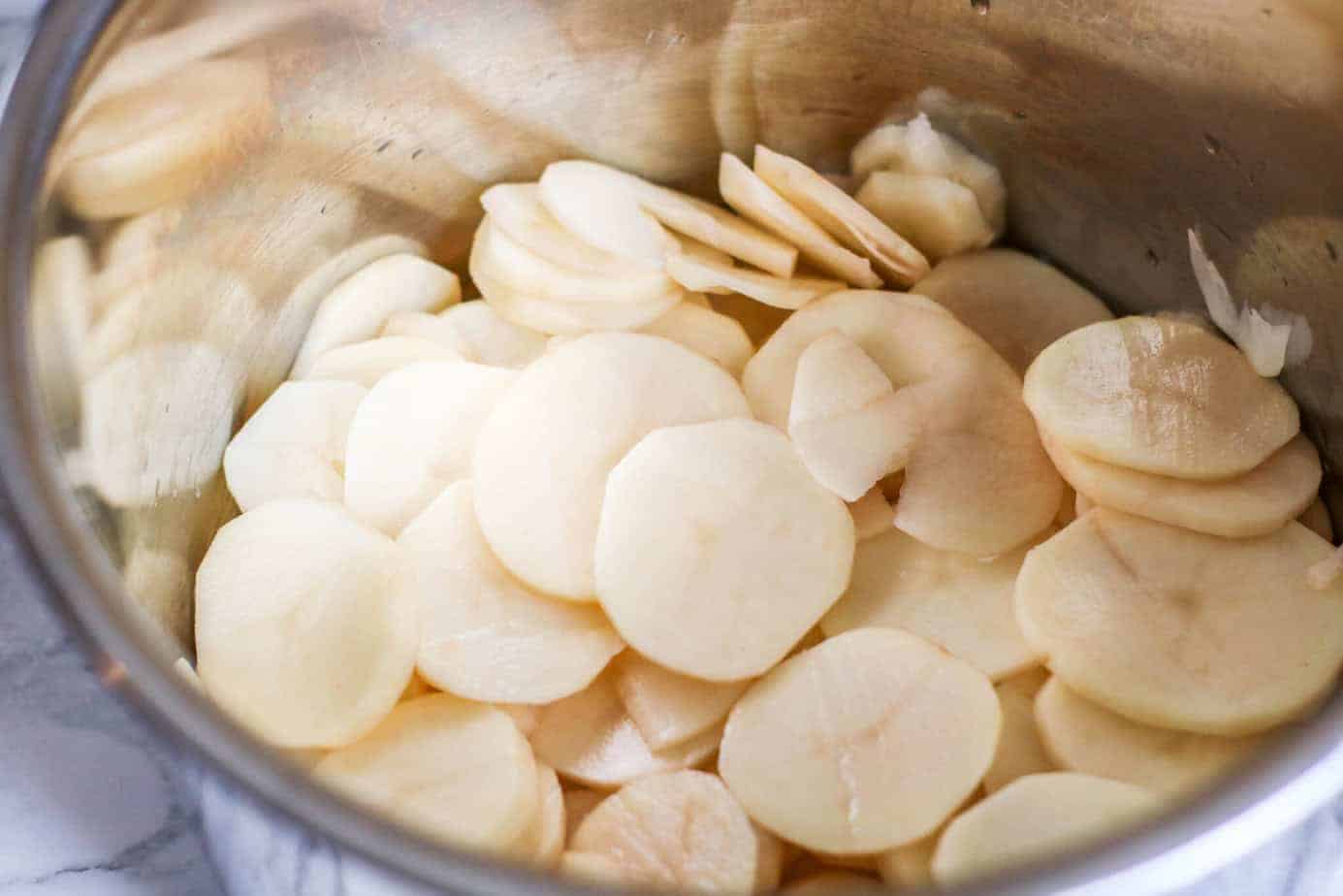 sliced potatoes in an Instant Pot inner pot