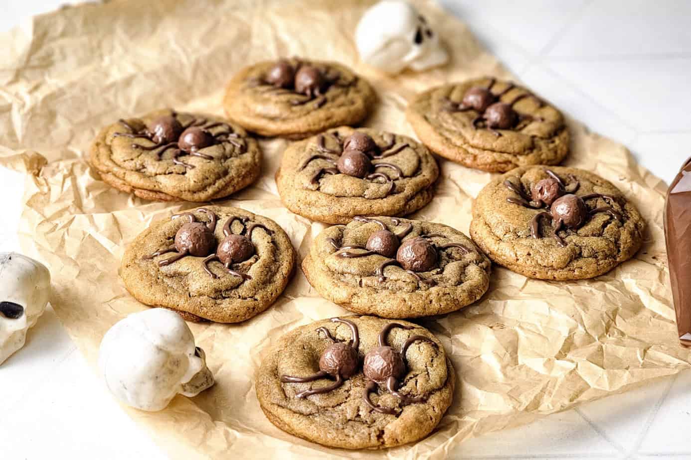 peanut butter spider cookies on parchment paper