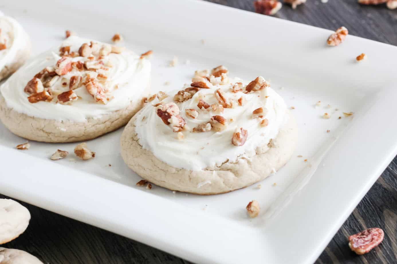 finished butter pecan cookies with cream cheese froting and pecans