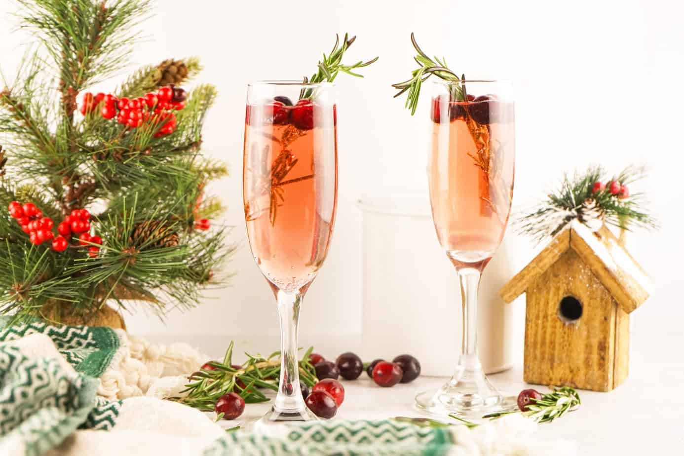 christmas mimosas with cranberries and rosemary
