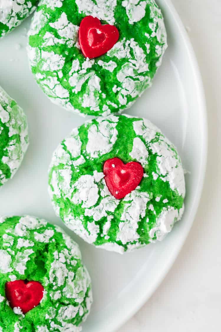grinch cookies on a white plate