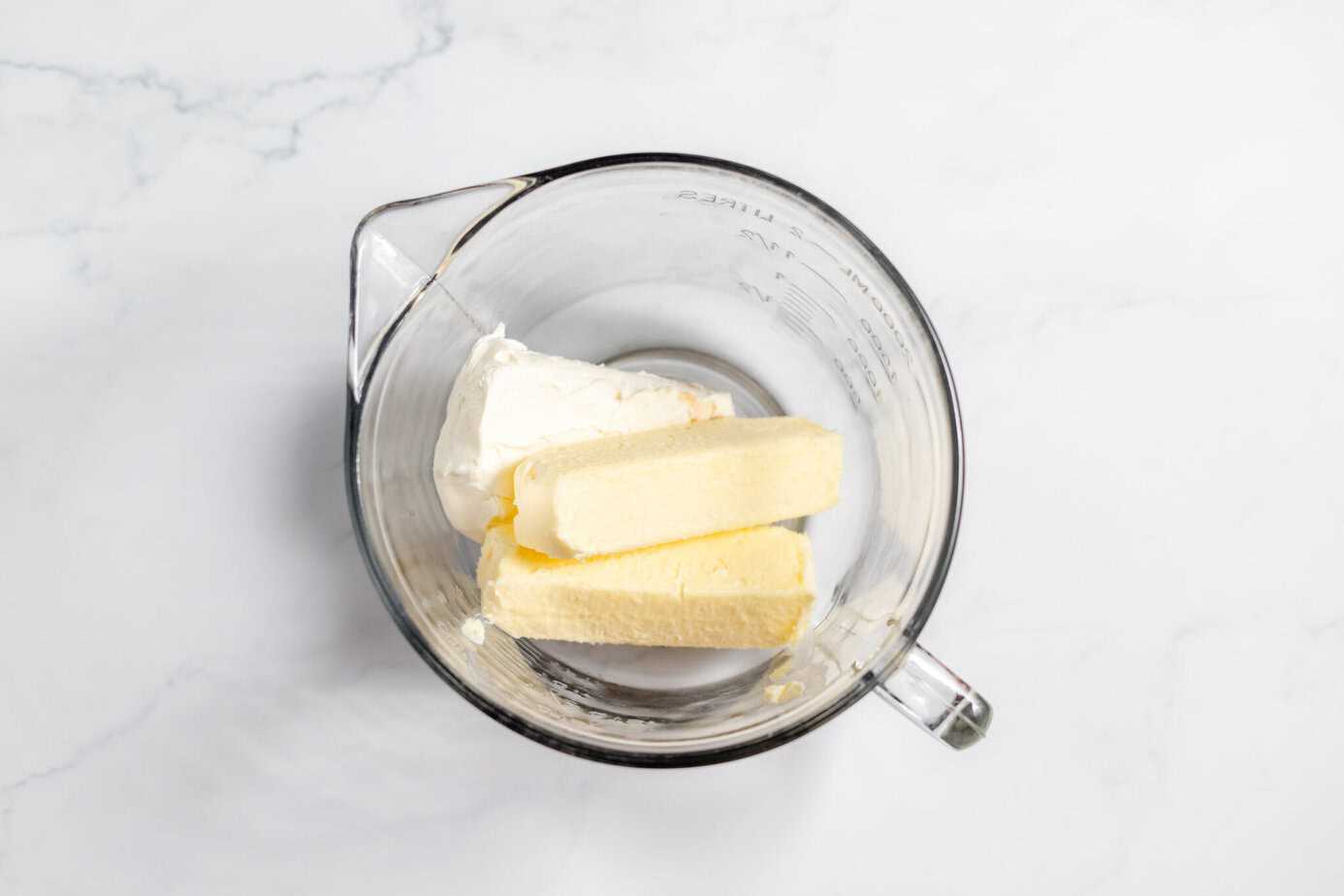 butter and cream cheese in clear bowl