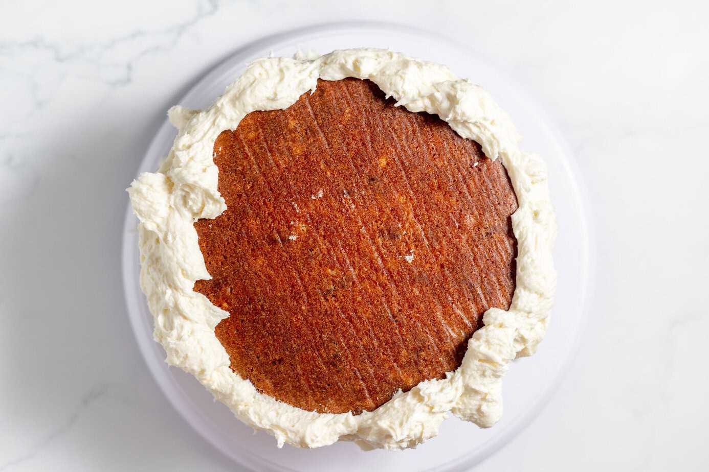 cream cheese frosting on sides of italian cream cake