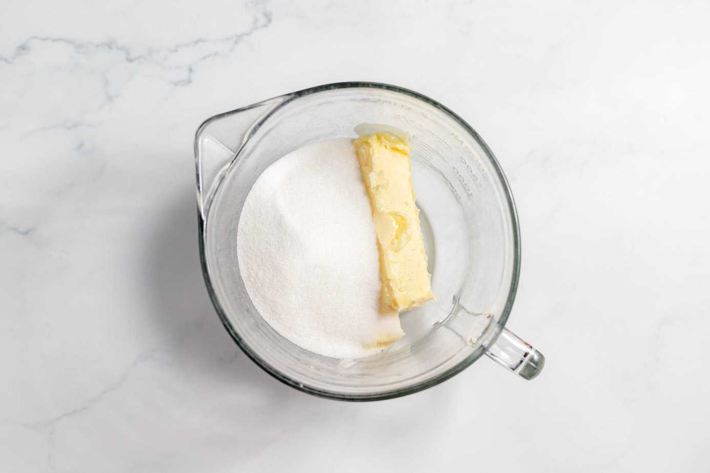 dry ingredients in clear bowl with butter