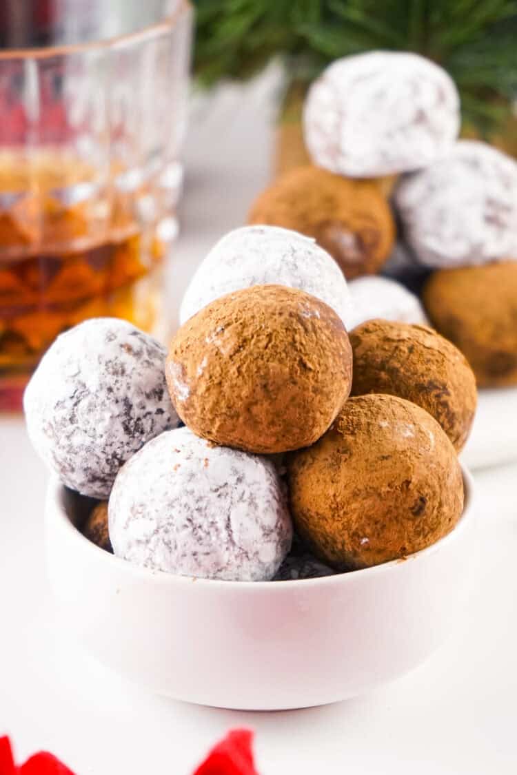 whiskey balls in a small white bowl