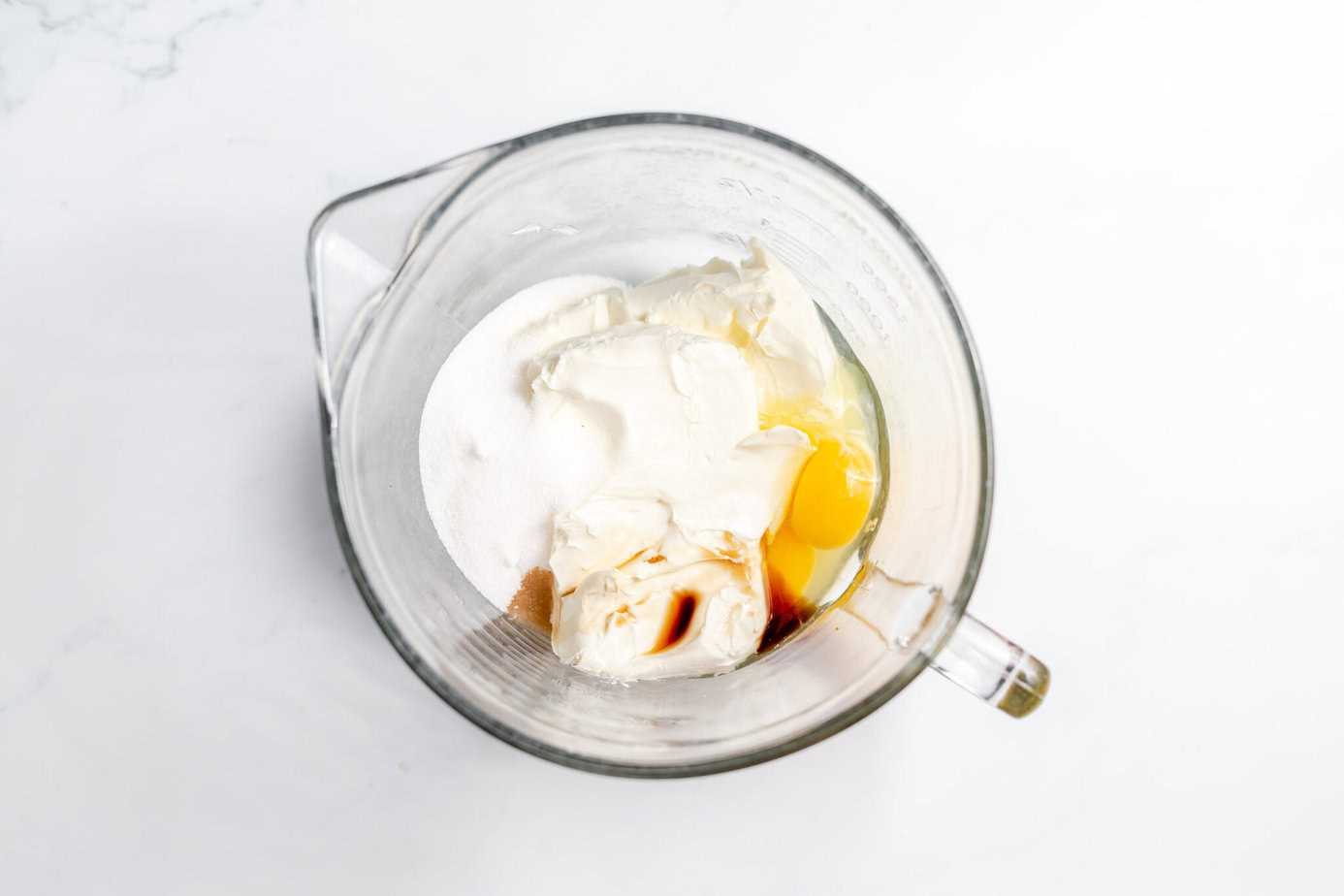 cheesecake filling ingredients in a mixing bowl