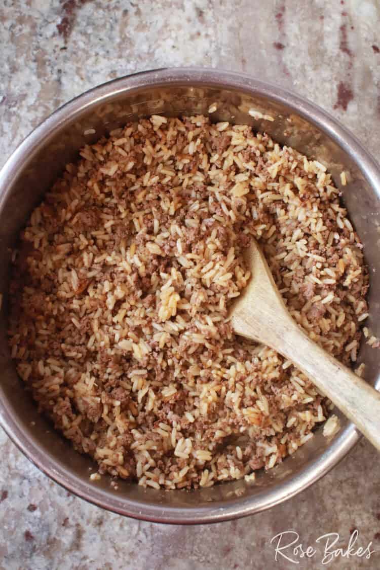 instant pot zatarain's dirty rice with wood spoon