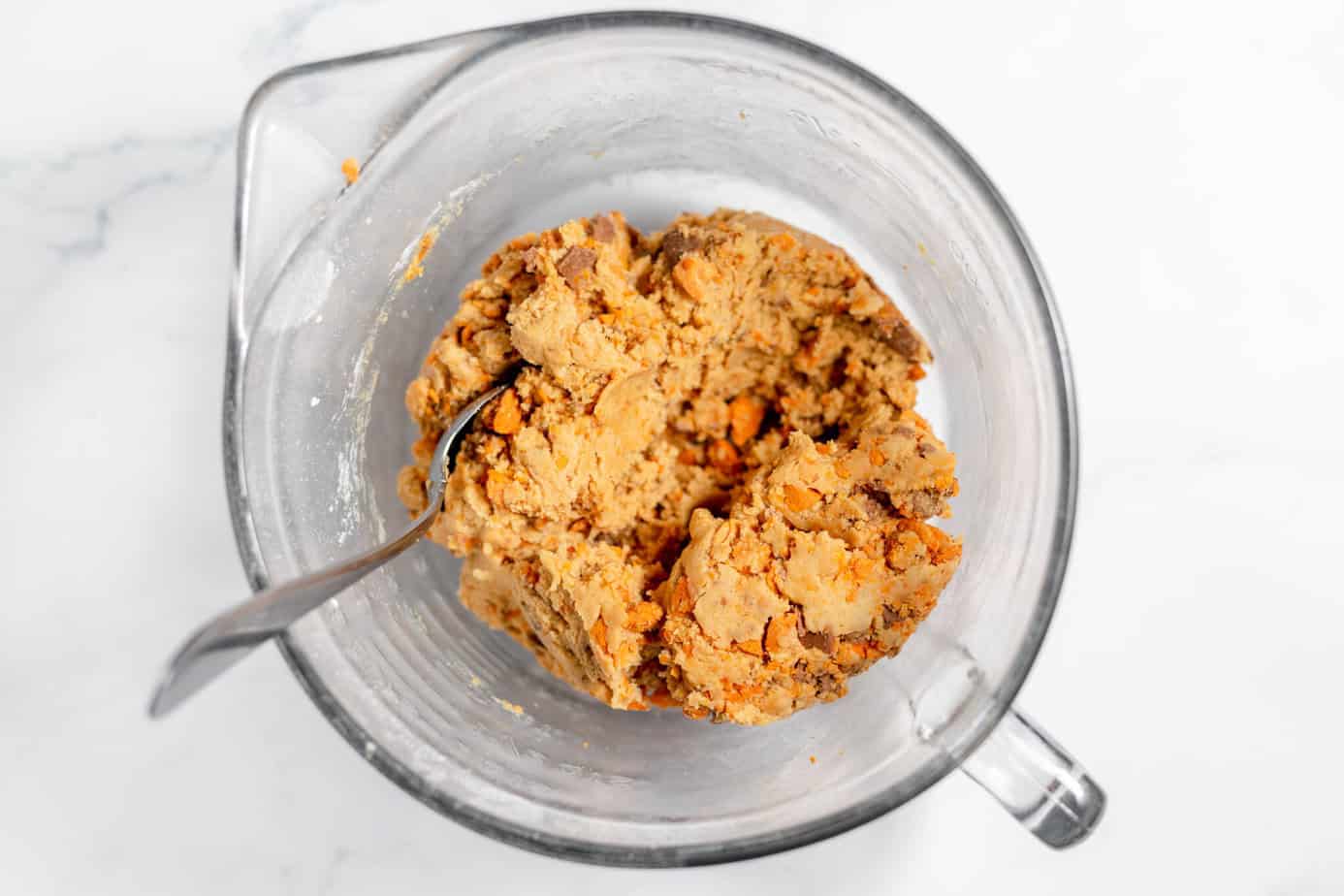 finished butterfinger cookie dough in a mixing bowl