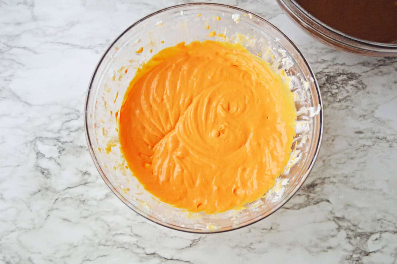cream cheese cheesecake mixture with orange coloring