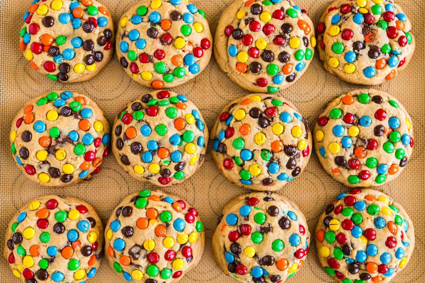 baked chocolate M&M Cookies on silpat on cookie sheet