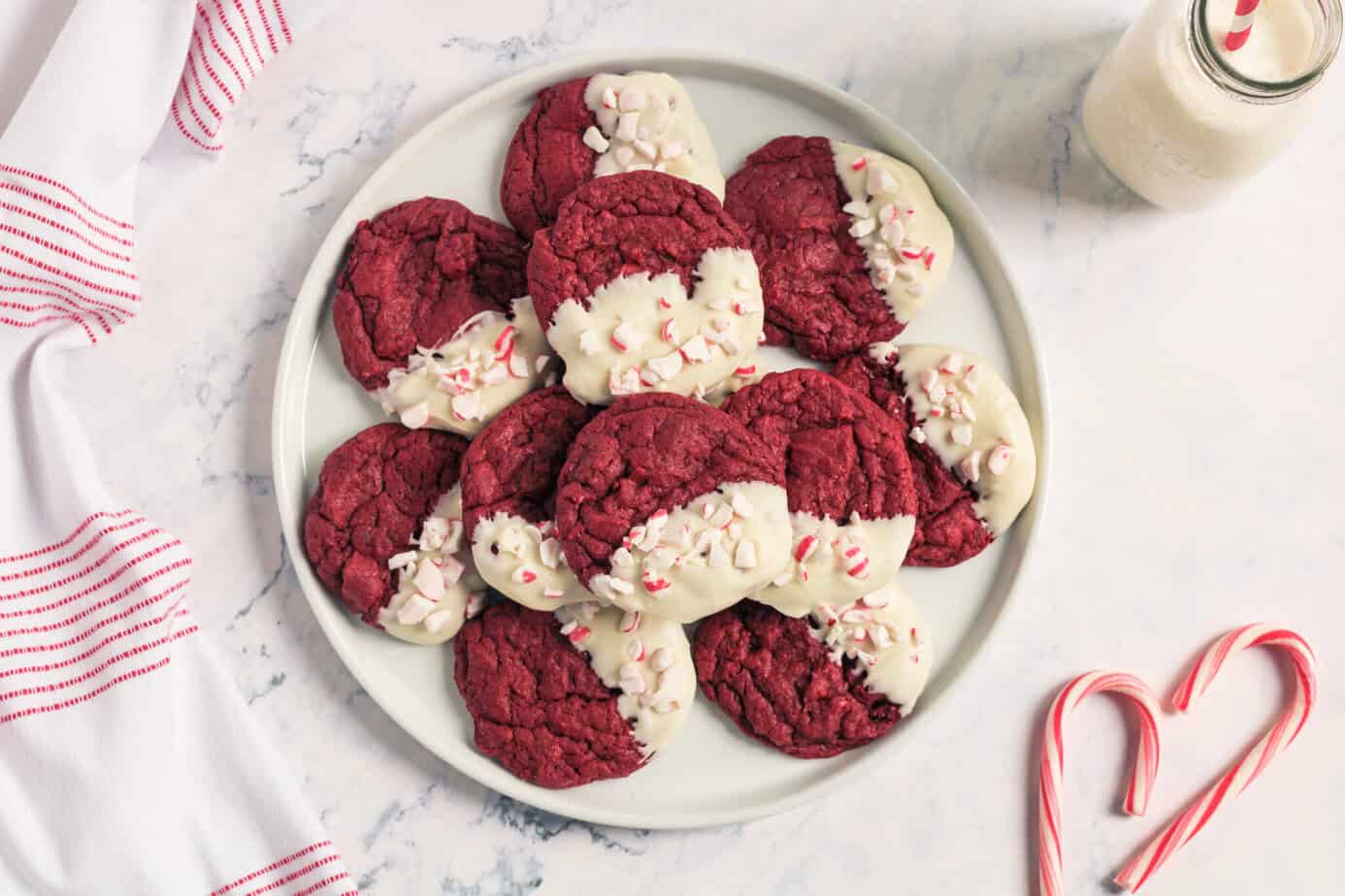 Red Velvet Peppermint Cookies stacked on a white plate