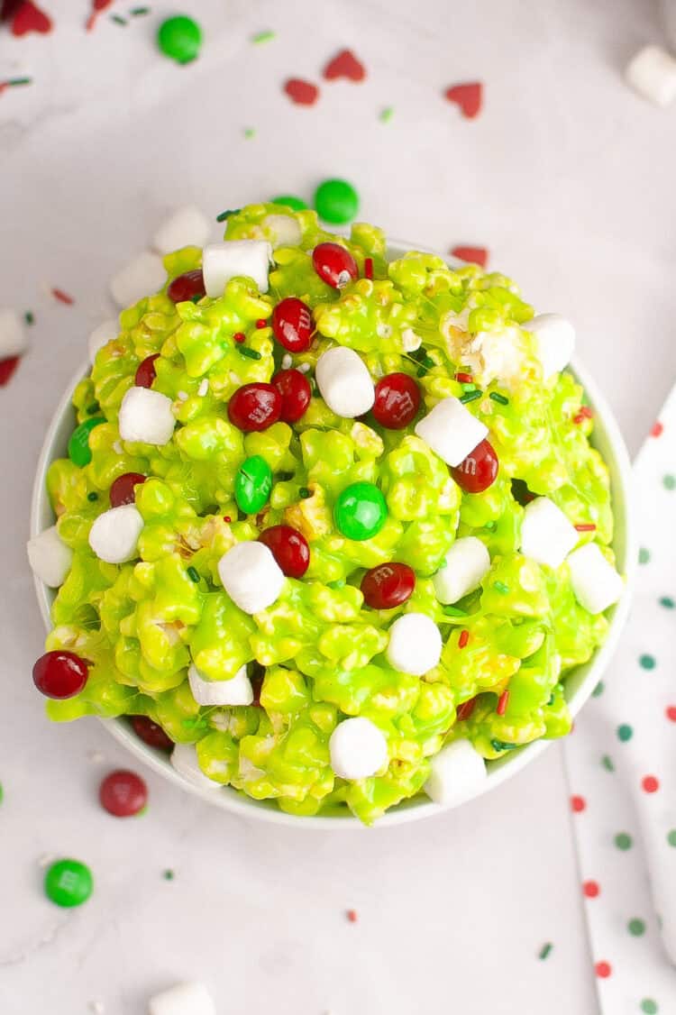 grinch popcorn in a white bowl