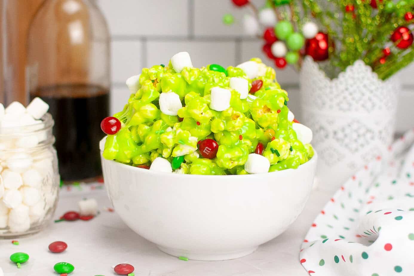 grinch popcorn in a white bowl