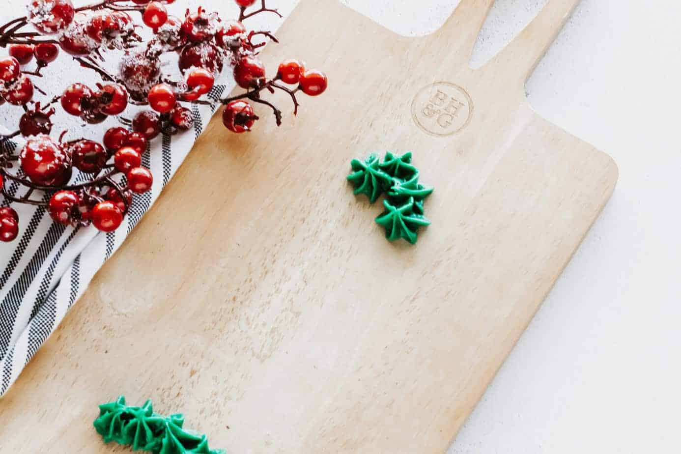 a few piped stars - the beginning of the christmas tree frosting board