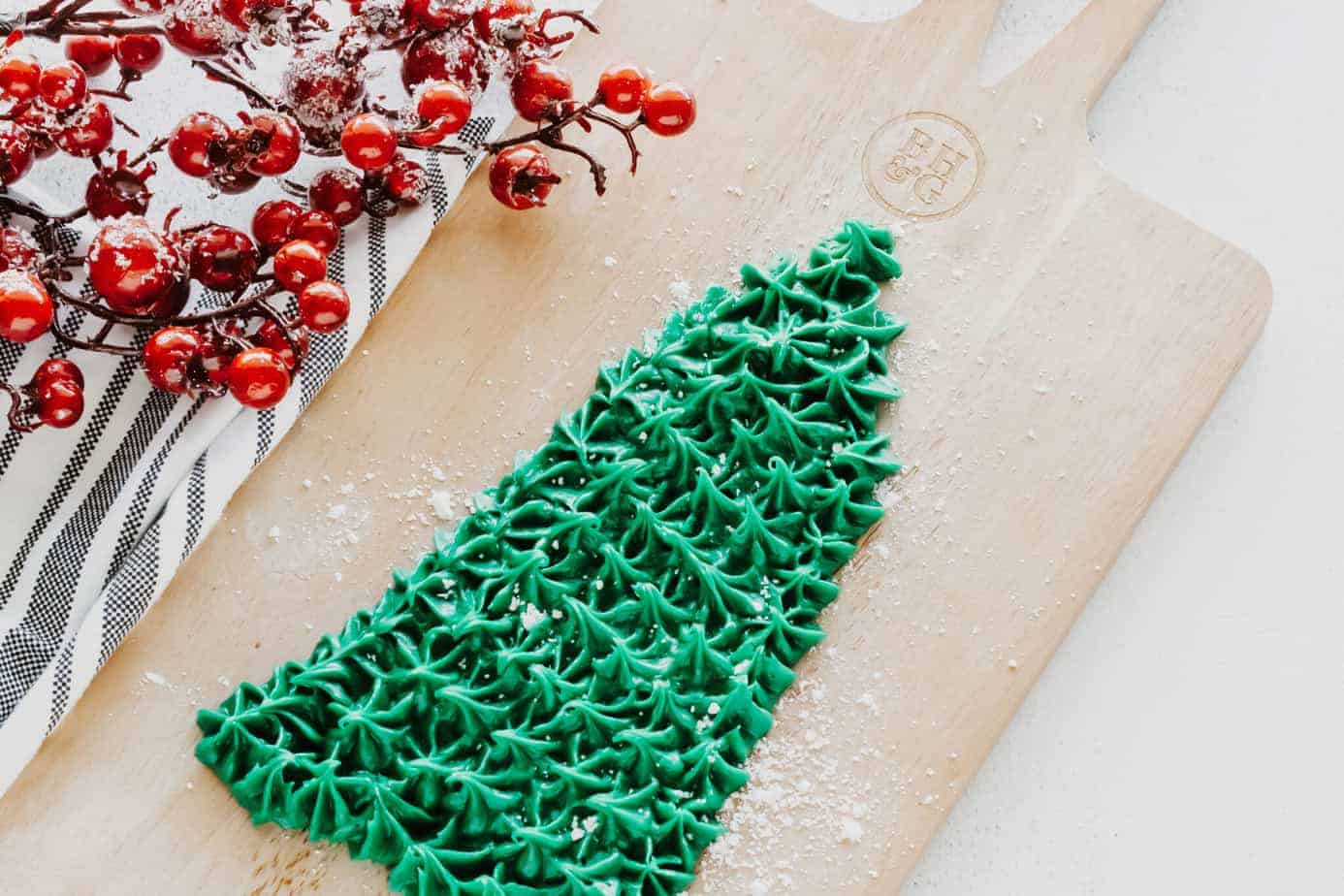 adding decor to the christmas frosting board