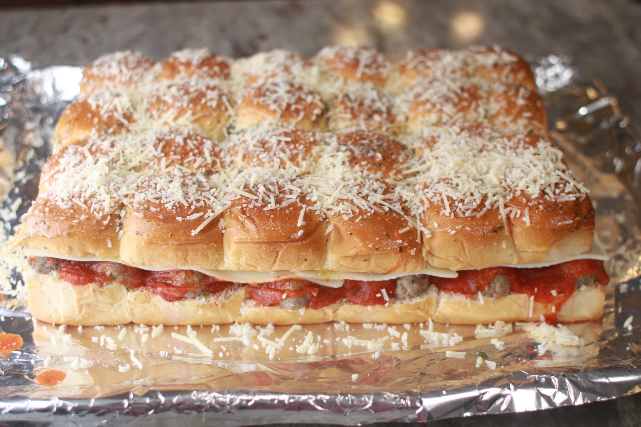 hawaiian roll meatball sliders ready to go in the oven