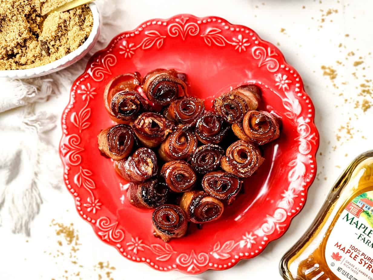 heart-shaped bacon roses on a red plate
