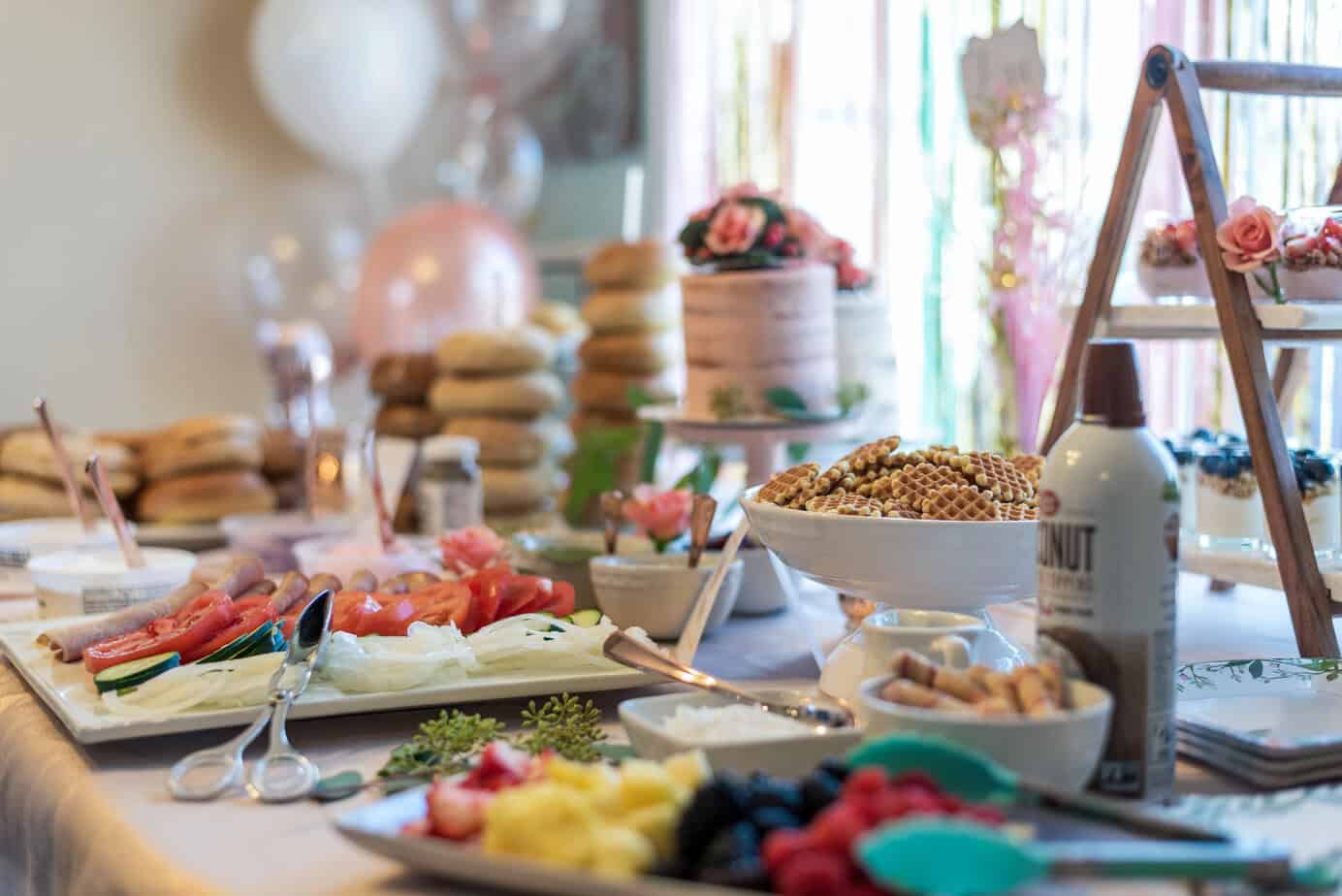 table covered with dishes and brunch foods
