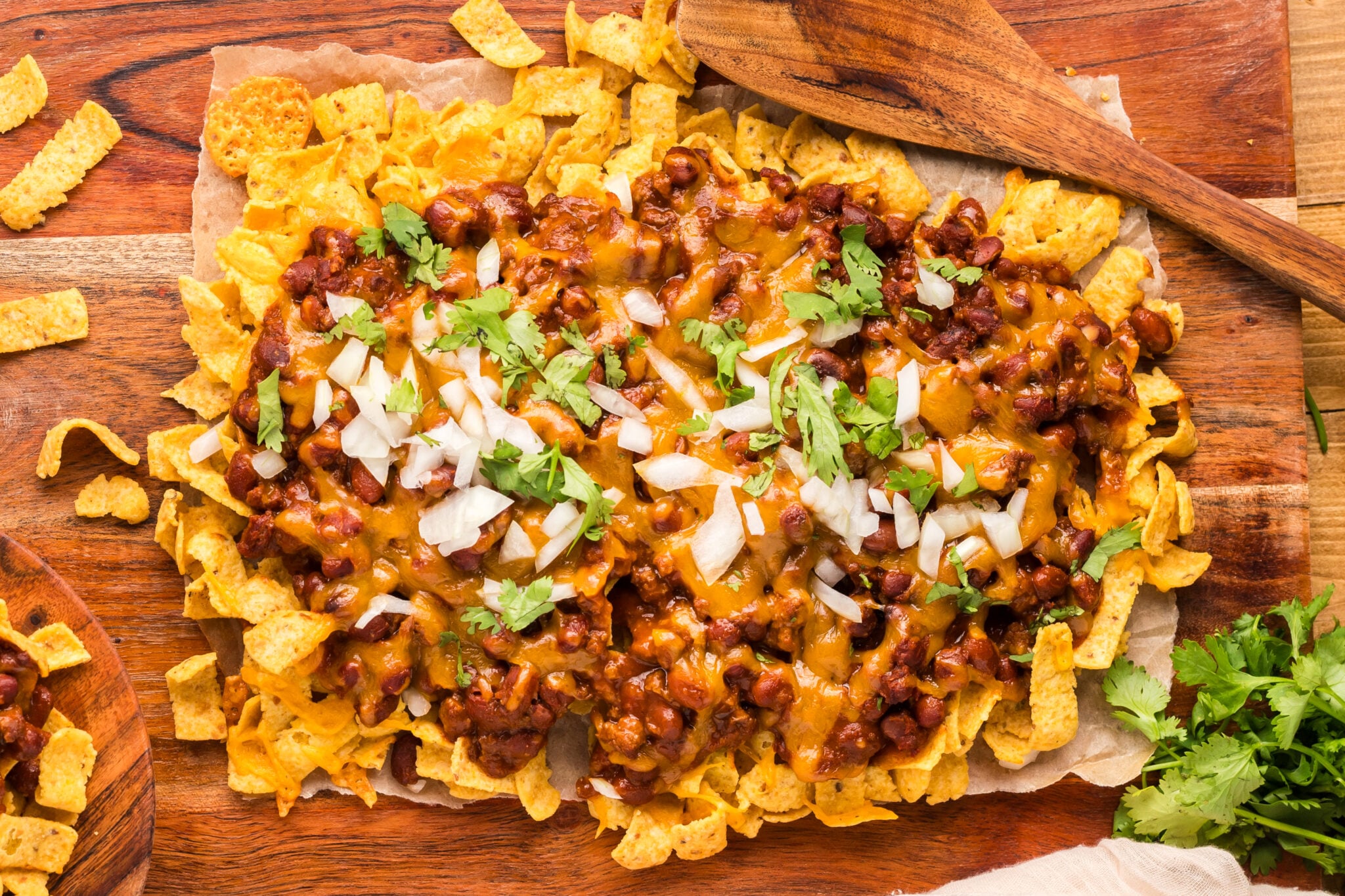 baked frito chili pie on parchment paper