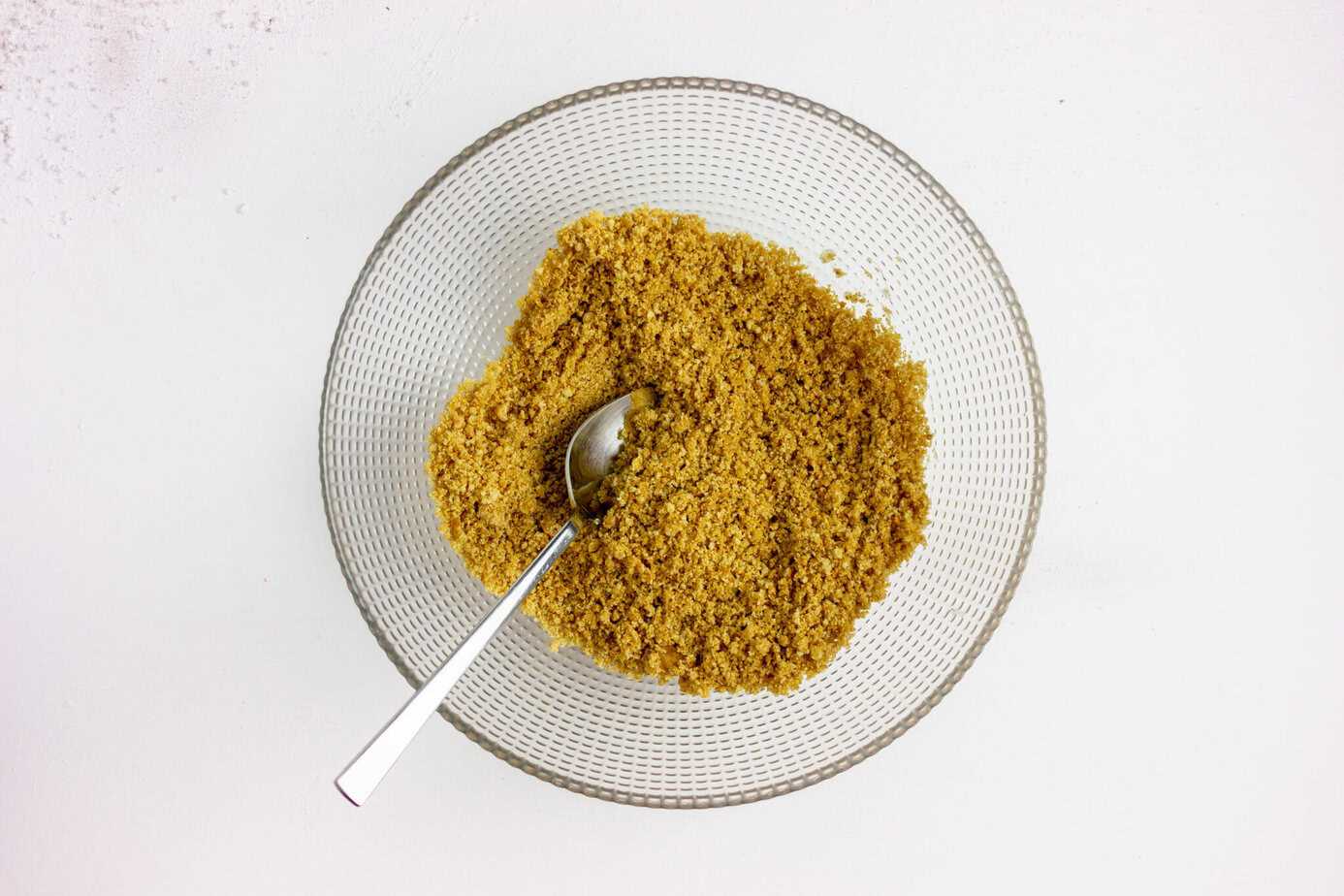 making graham cracker crust in clear mixing bowl