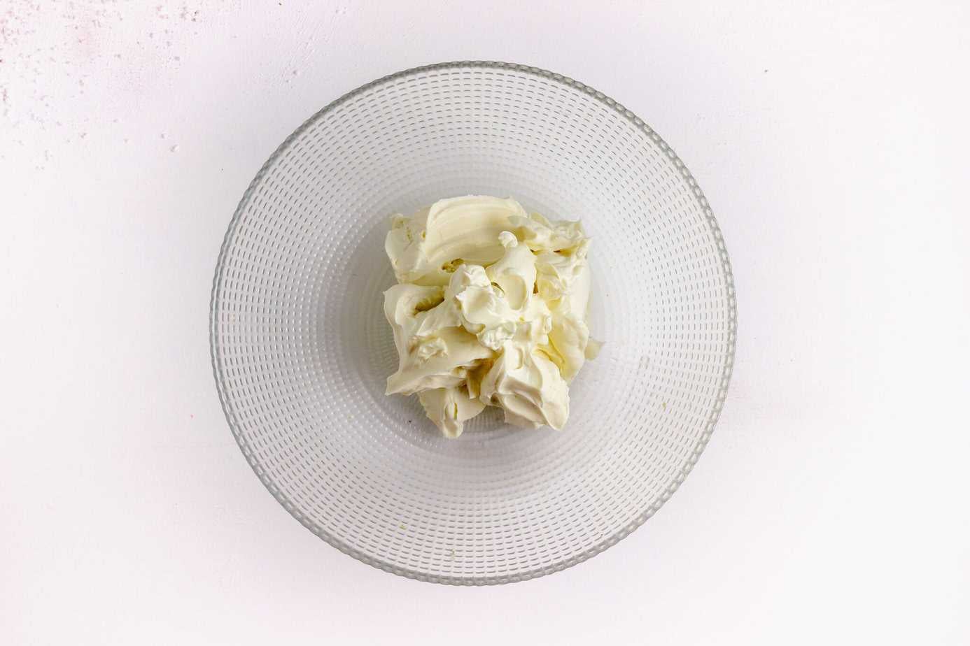 cream cheese in clear mixing bowl