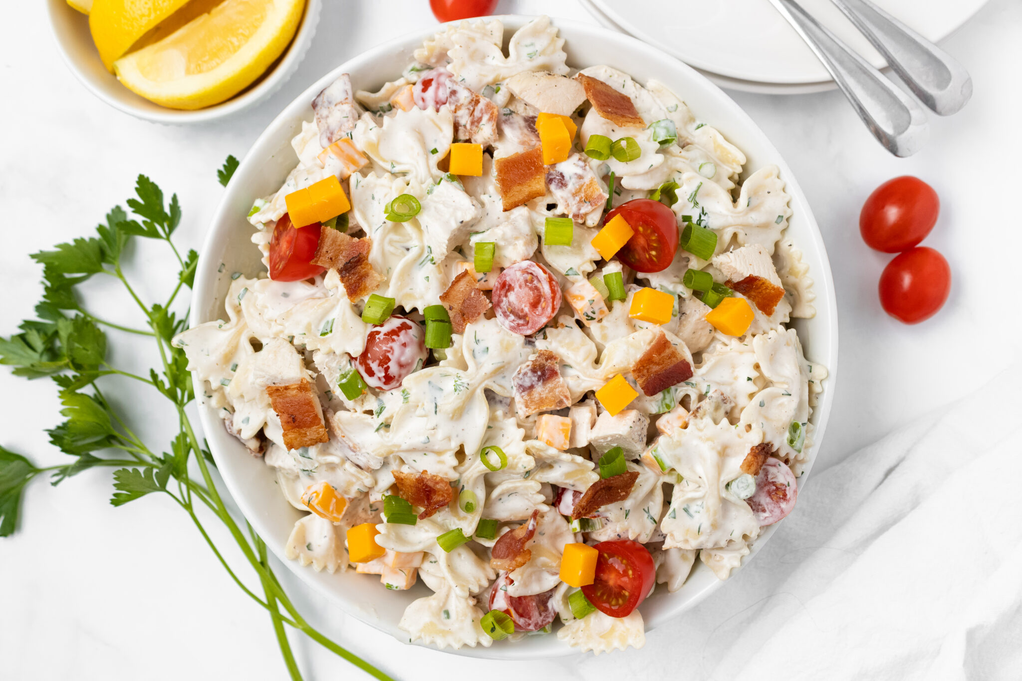 chicken bacon ranch pasta salad in a white bowl