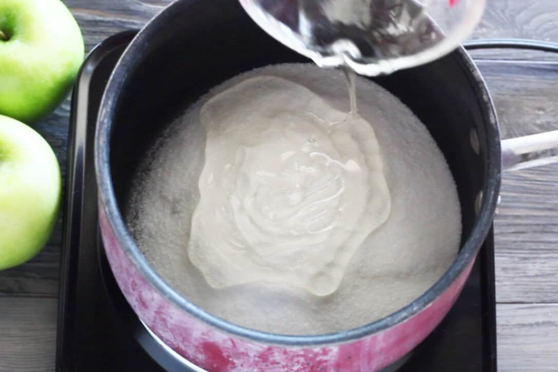 adding corn syrup to sugar