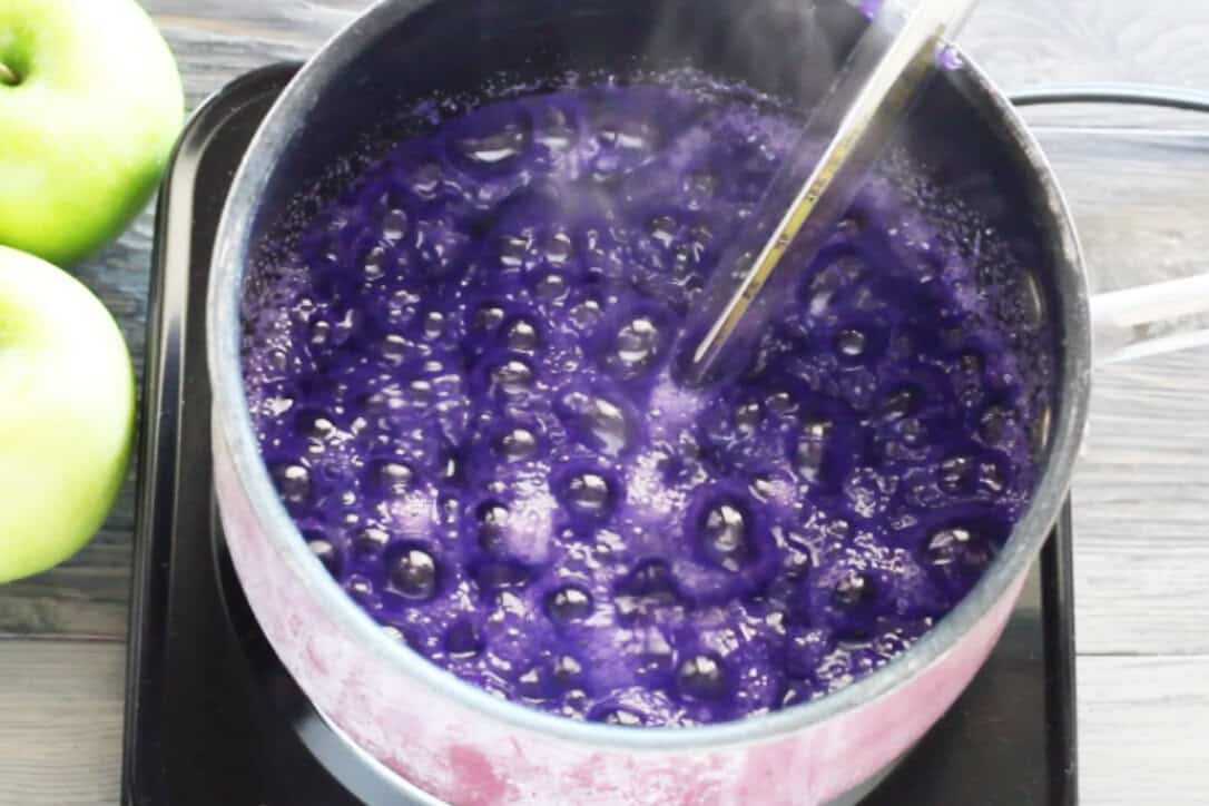 candy apple sugar boiling with candy thermometer