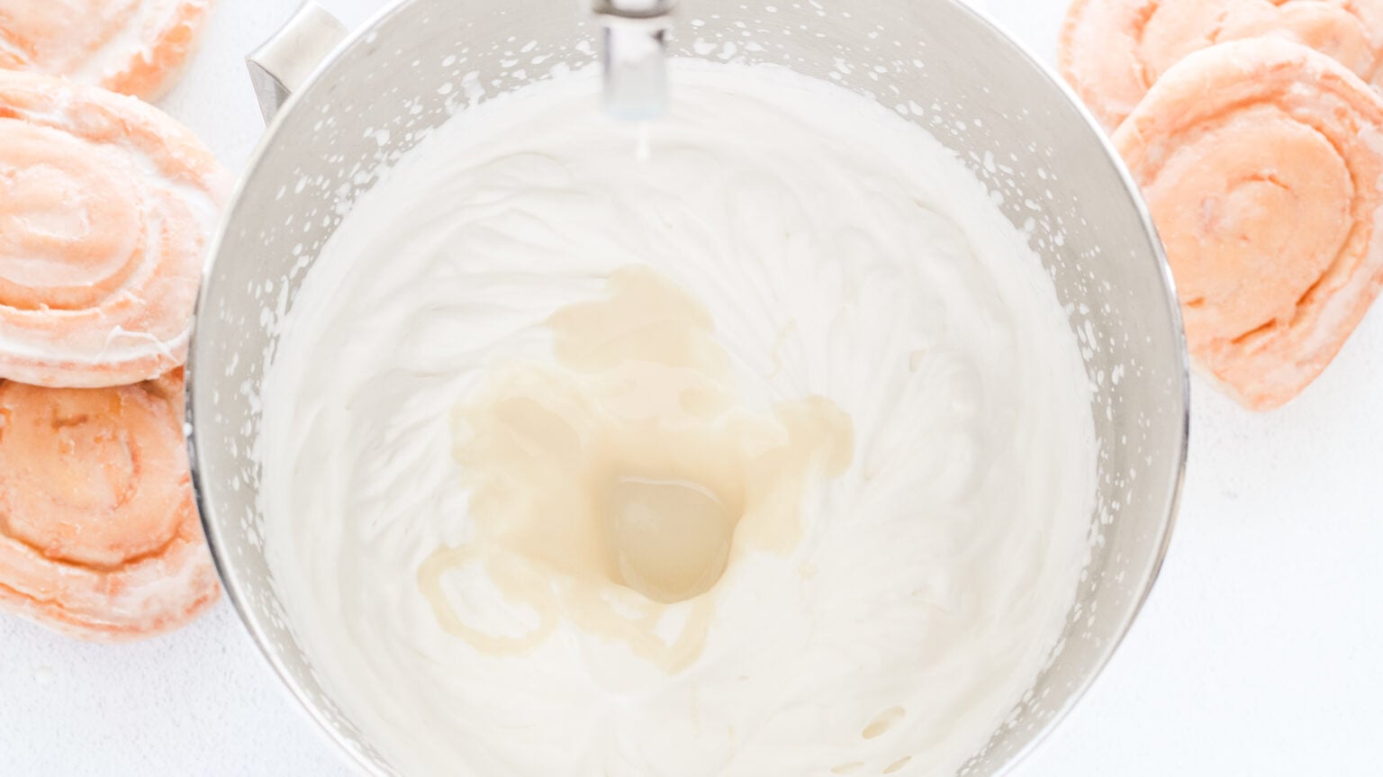 whipped cream in mixing bowl with sweetened condensed milk