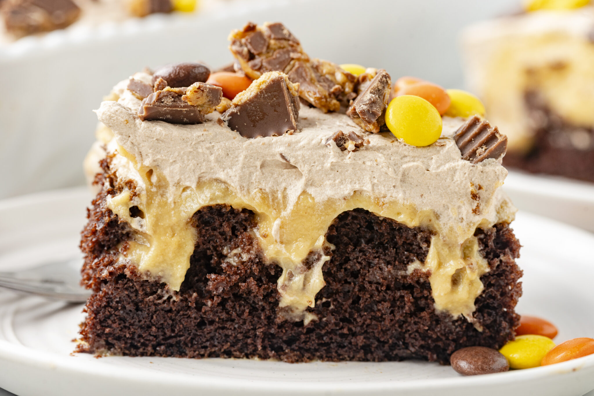 slice of chocolate peanut butter poke cake