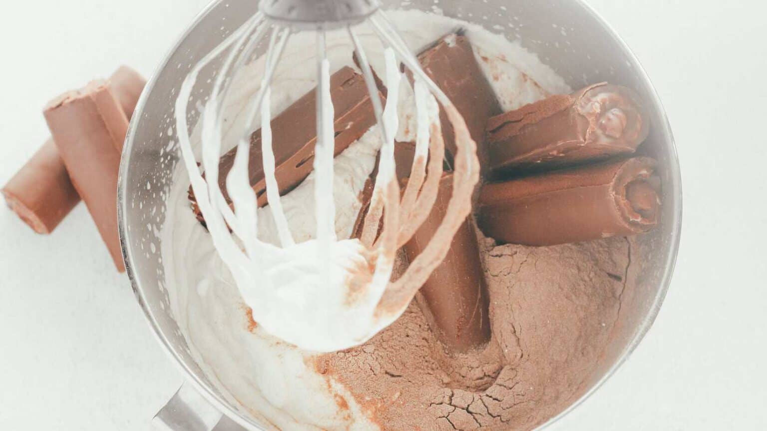 adding swiss rolls to the mixing bowl