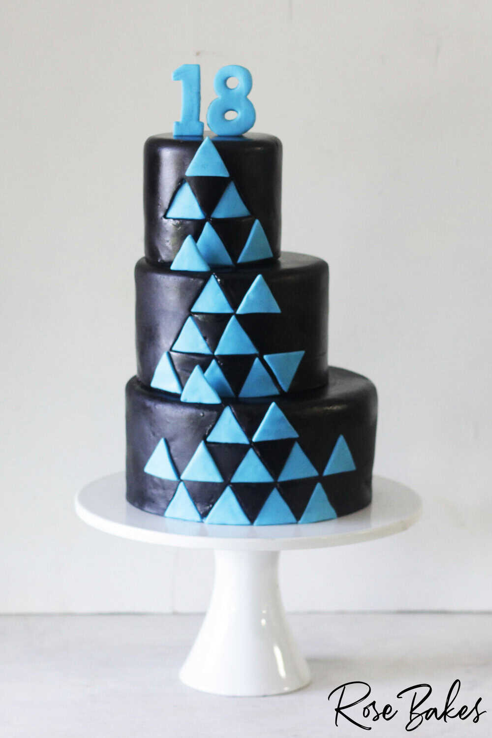 black and blue triangle offset tiered cake