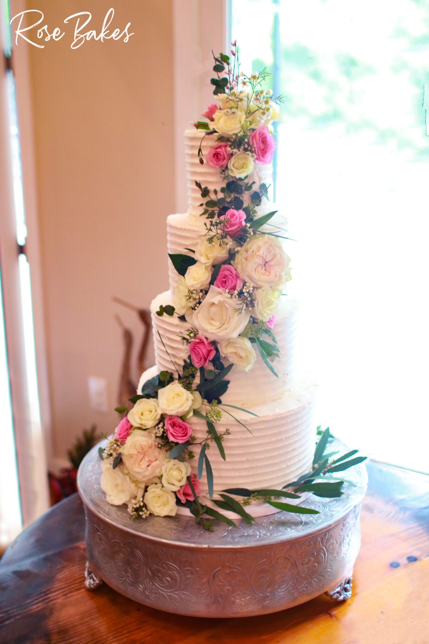 Cascading Pink and White Fresh Flowers Wedding Cake