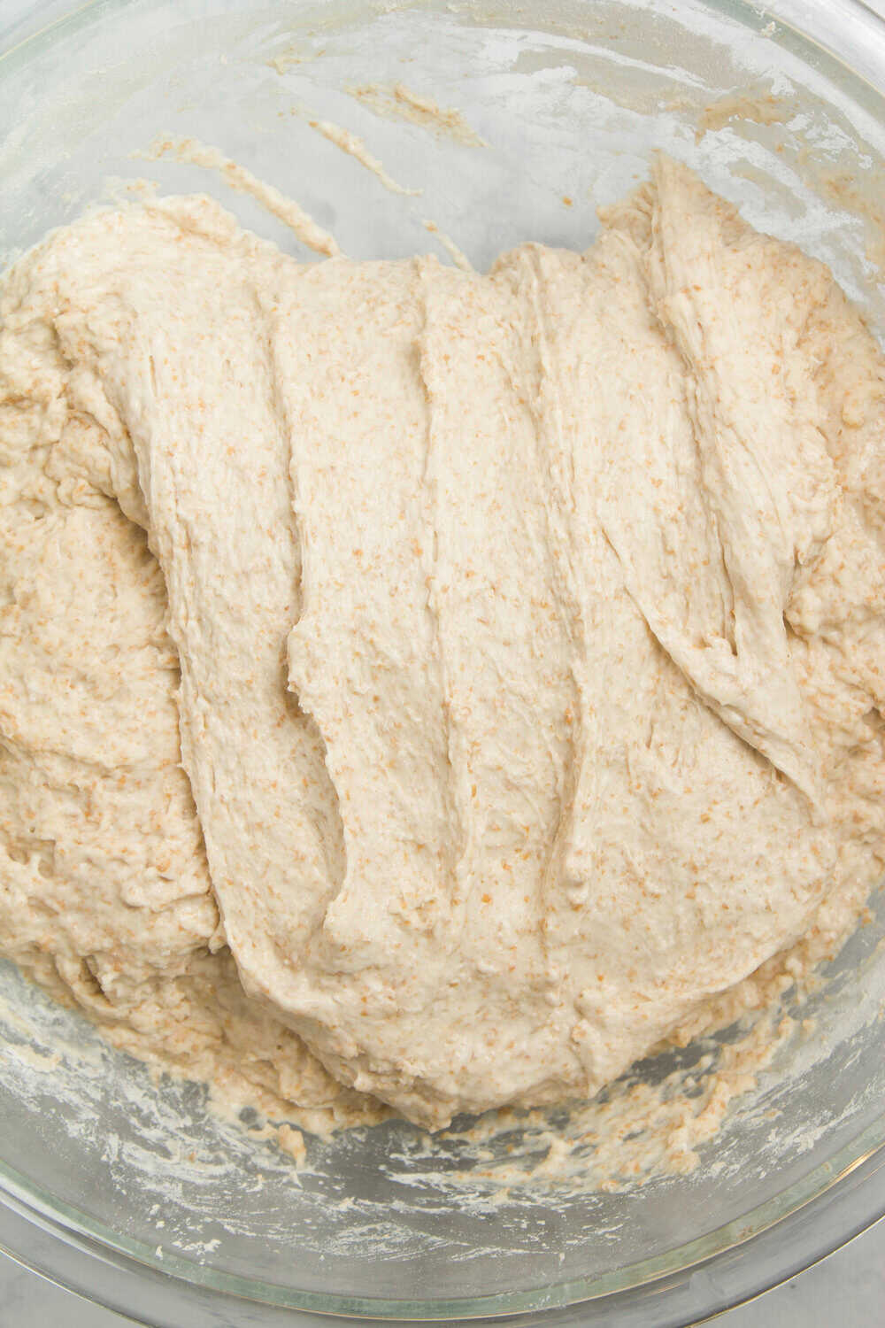 sourdough bread being stretched
