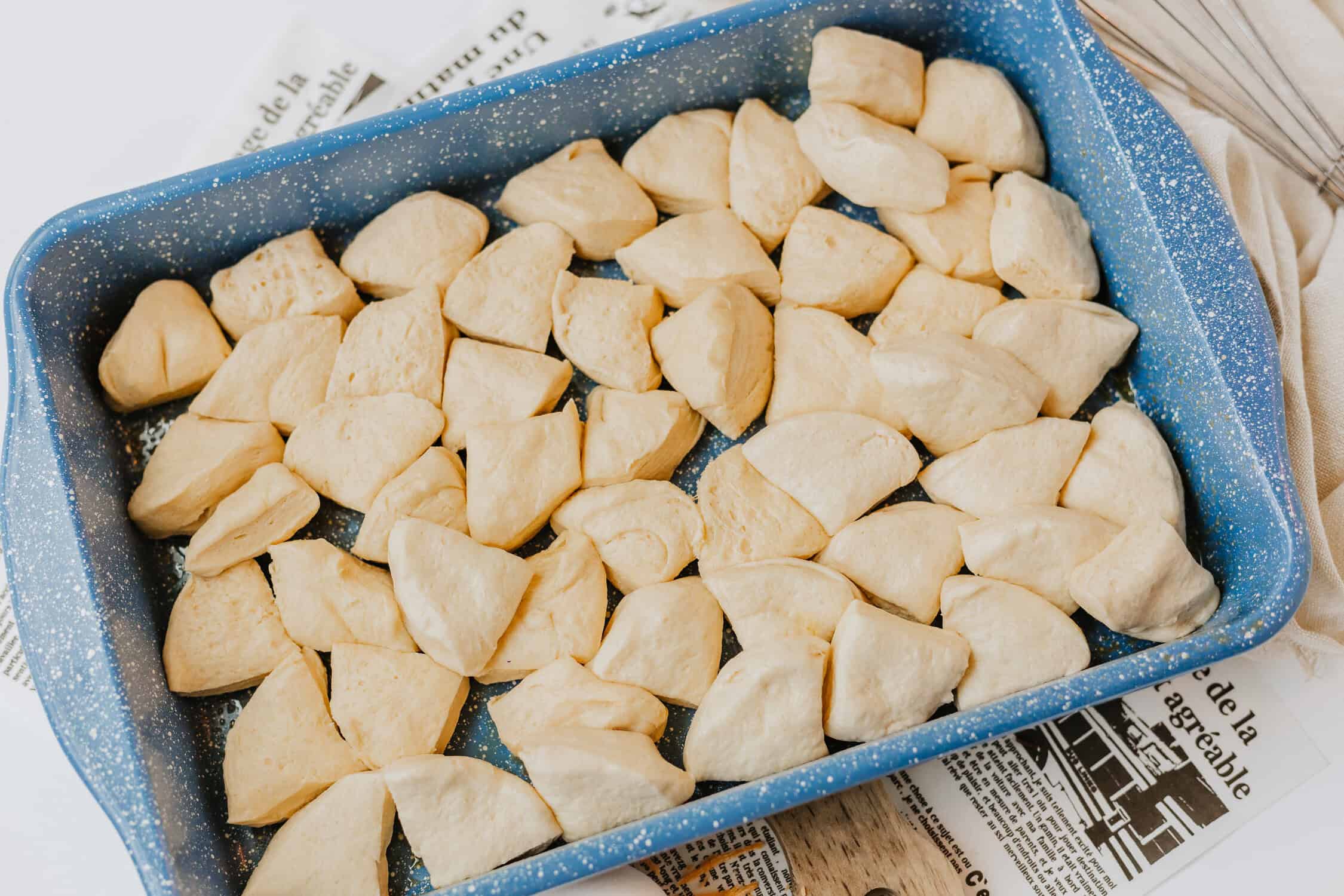 cut up biscuit pieces in a baking dish