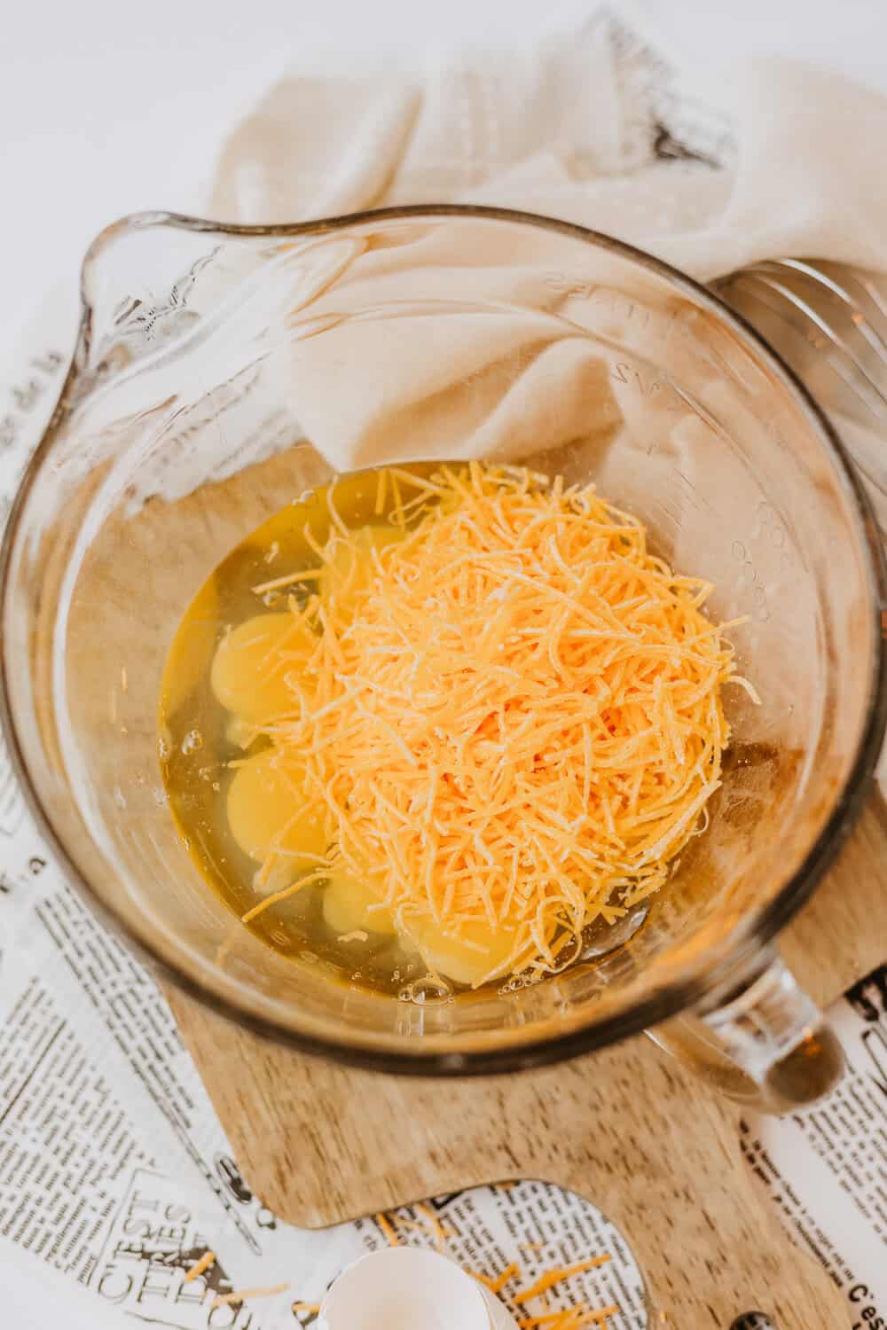 eggs and cheese in a mixing bowl