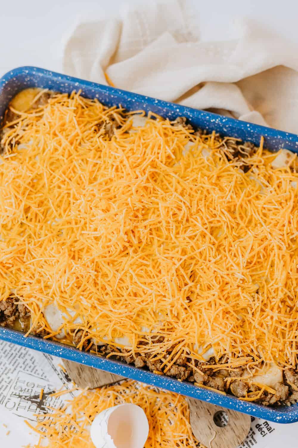 cheese on top of the biscuits and gravy casserole