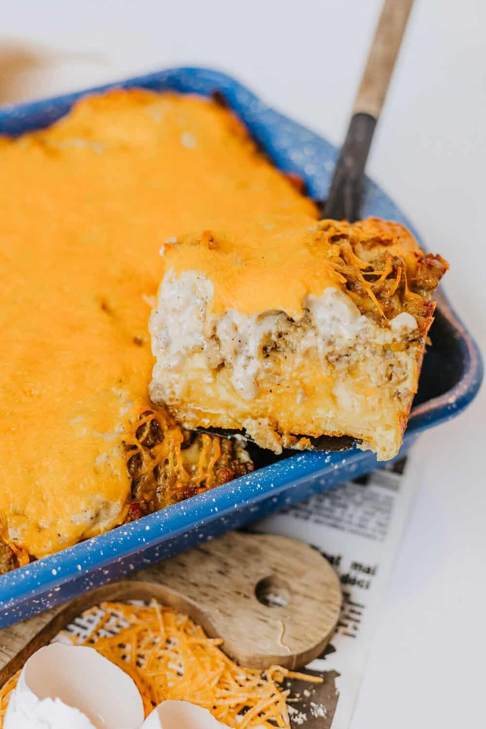 biscuits and gravy breakfast casserole with a slice cut out