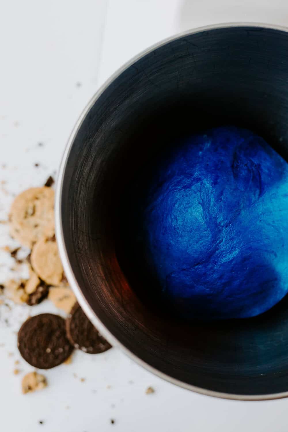 blue ball of cinnamon roll dough doubled in size