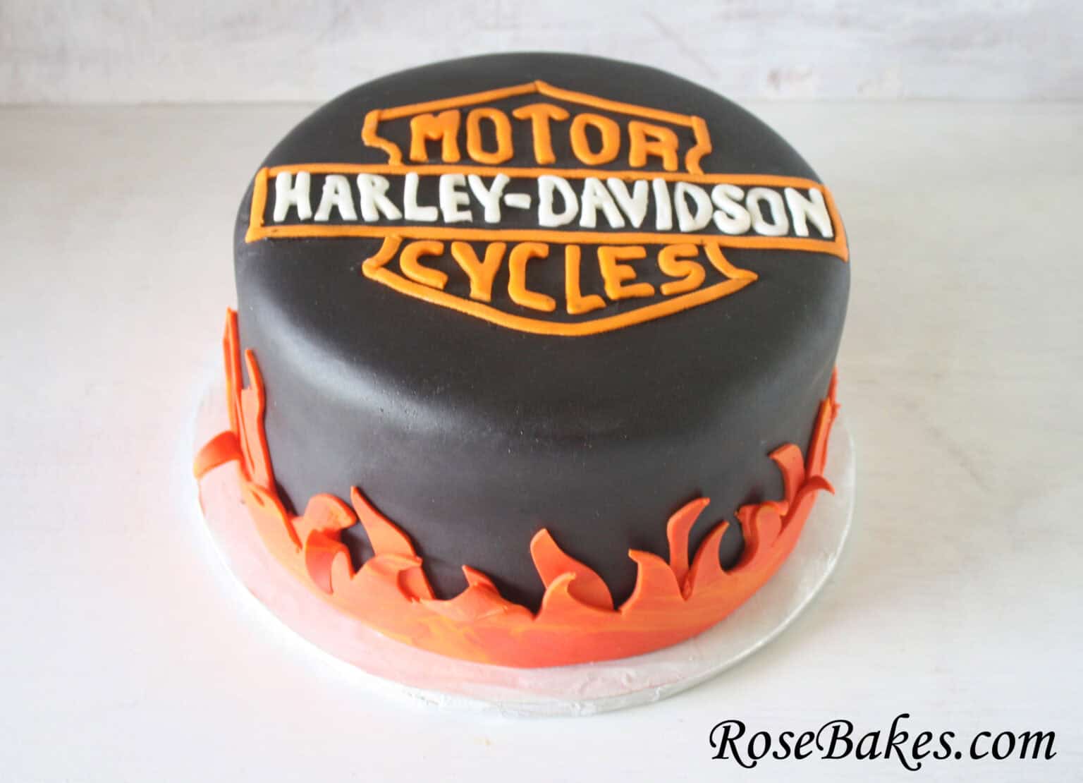 Harley-Davidson Motorcycles black cake with flames fondant around the base