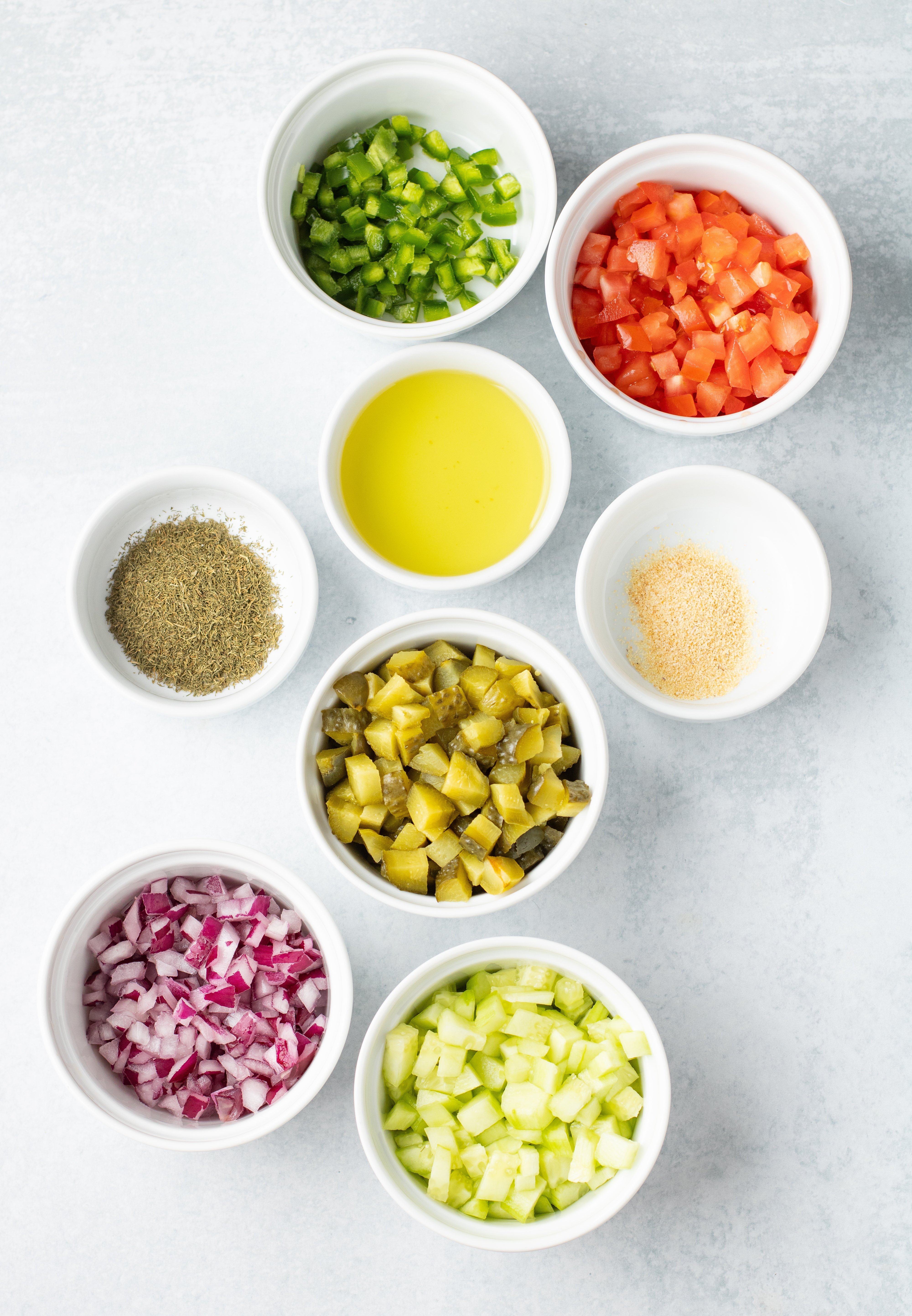 pickle de gallo ingredients in white bowls