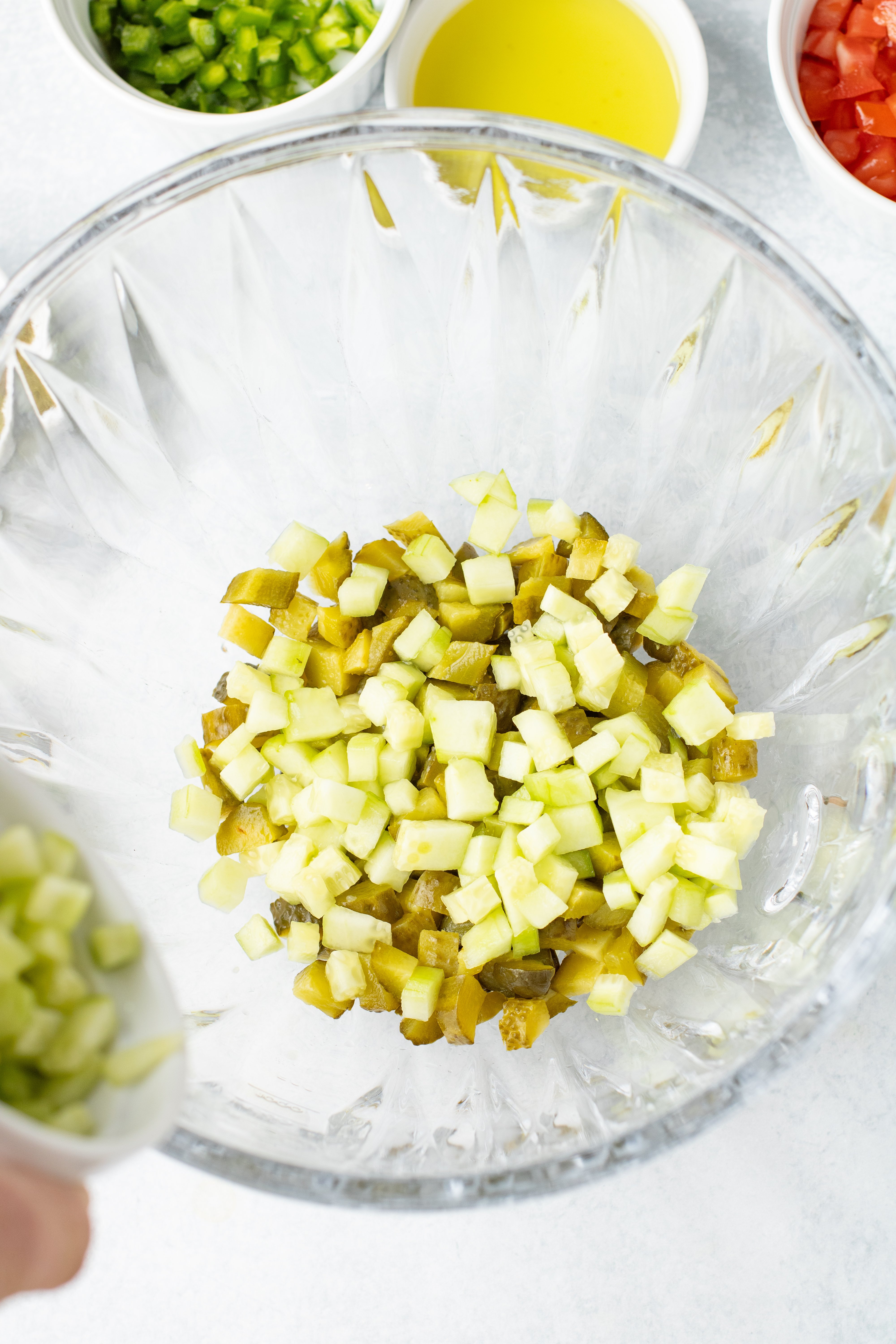 diced cucumbers and pickles in a bowl