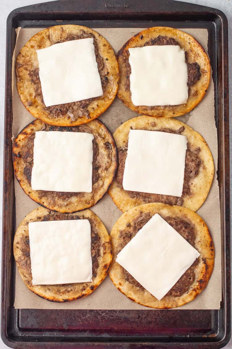 smash burger tacos cooked with cheese melting on top