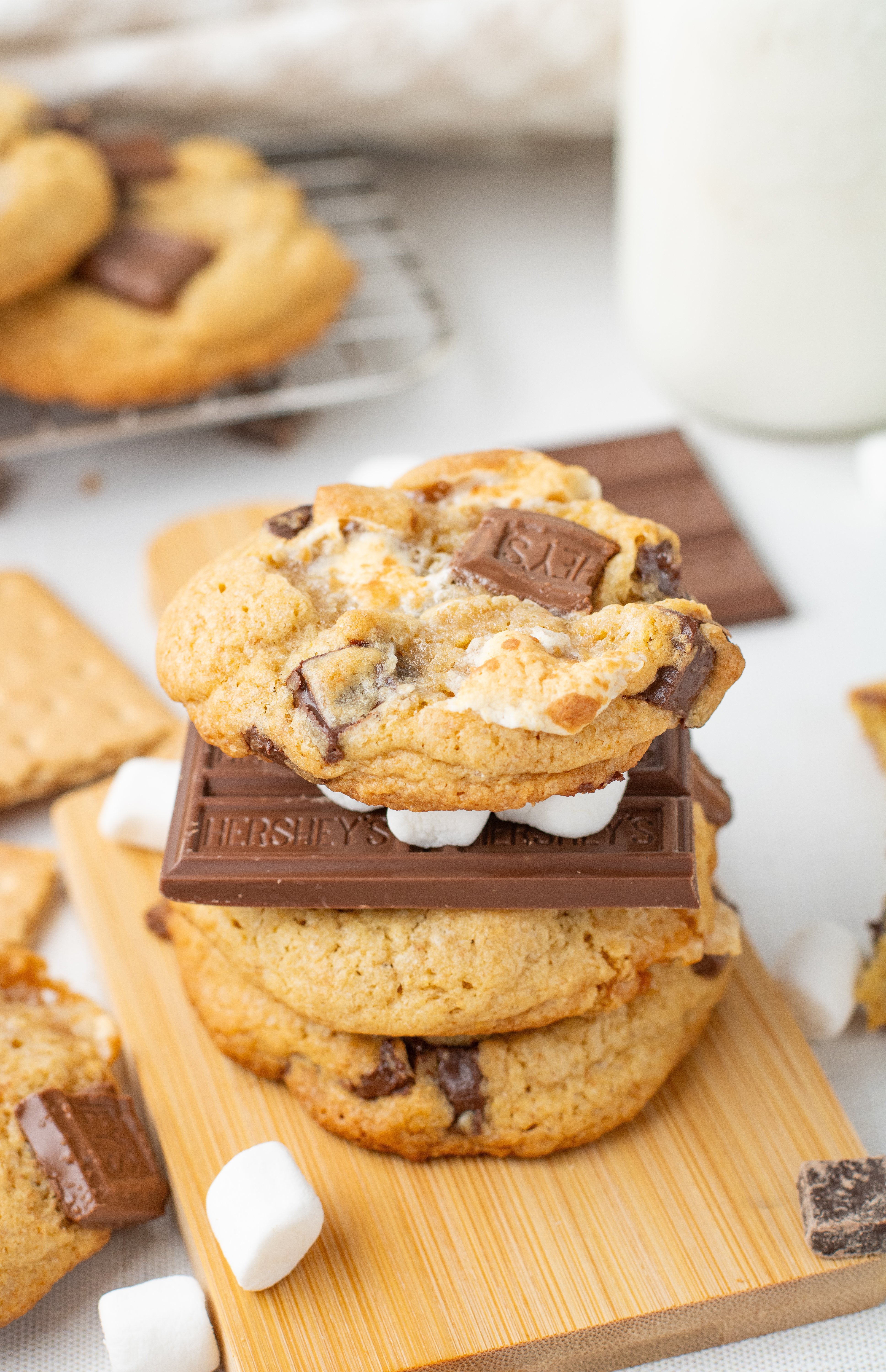 s'mores cookies stacked with Hershey chocolate bars