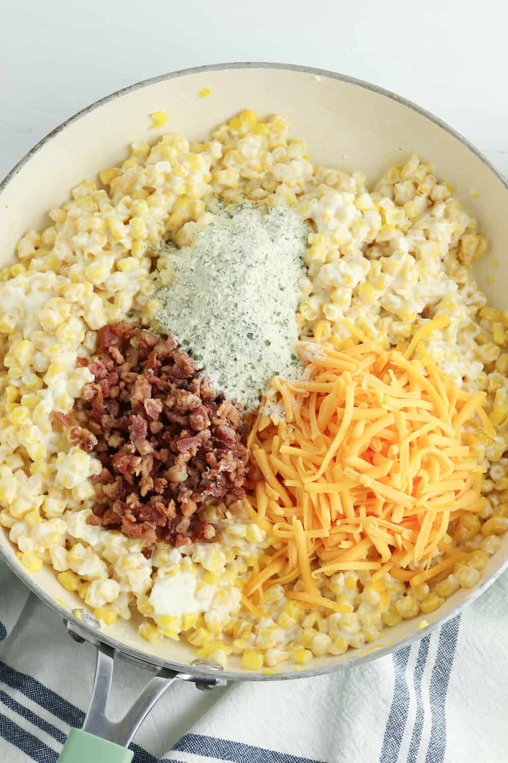 ranch seasoning, cheddar cheese and bacon added to buttered corn with cream cheese