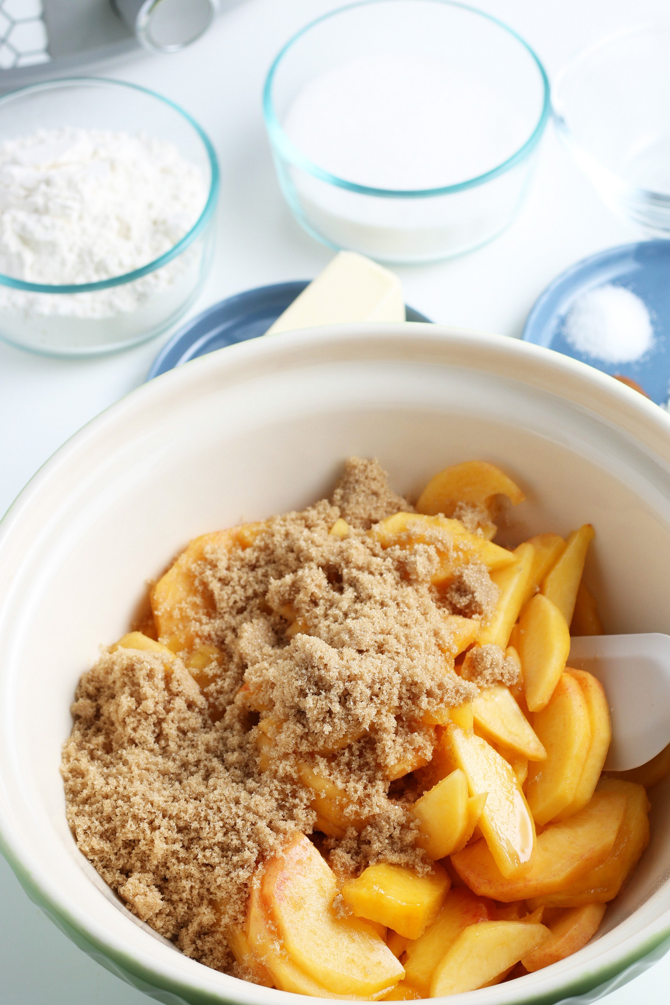 brown sugar over fresh peaches peeled and sliced