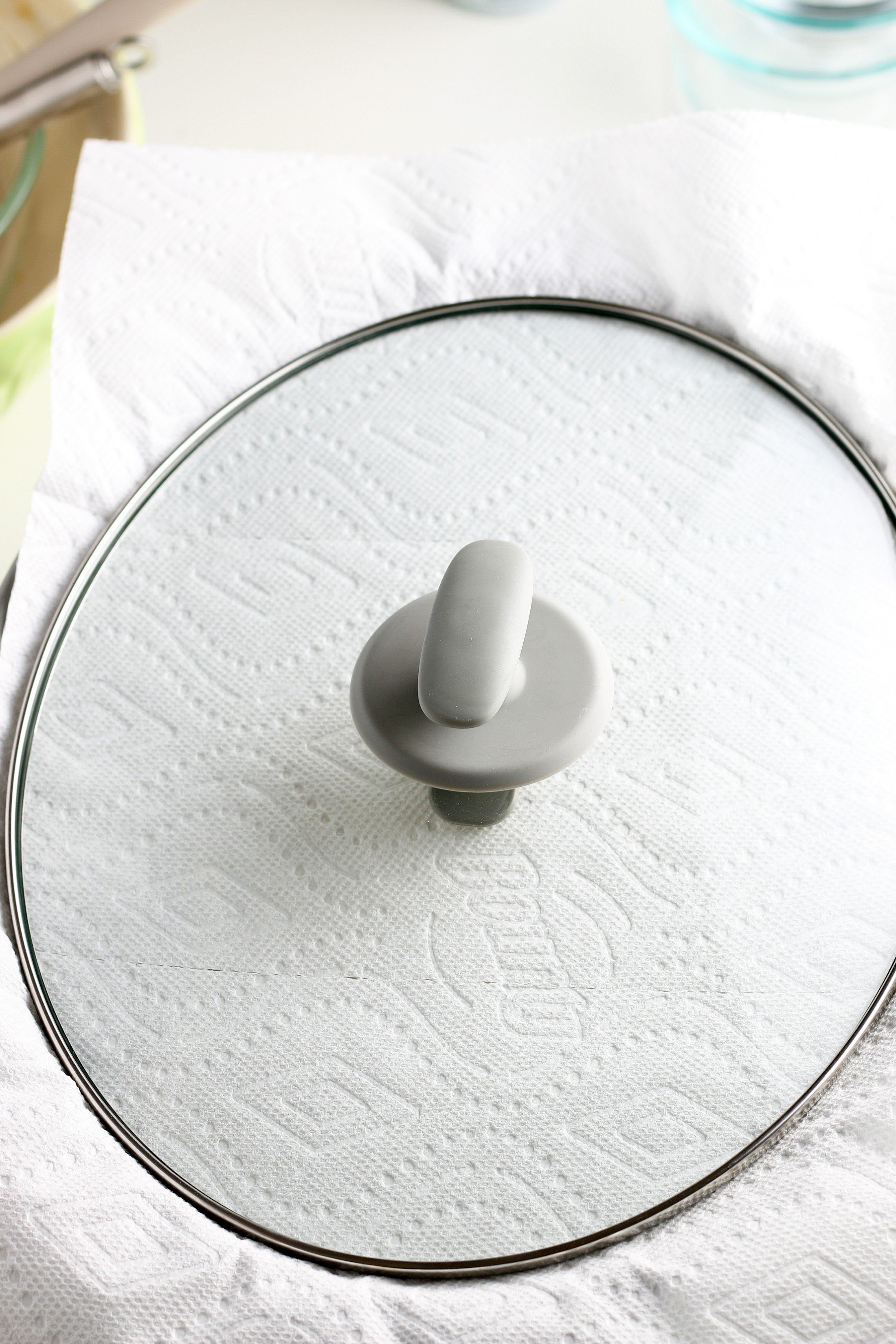 slow cooker lid over paper towel