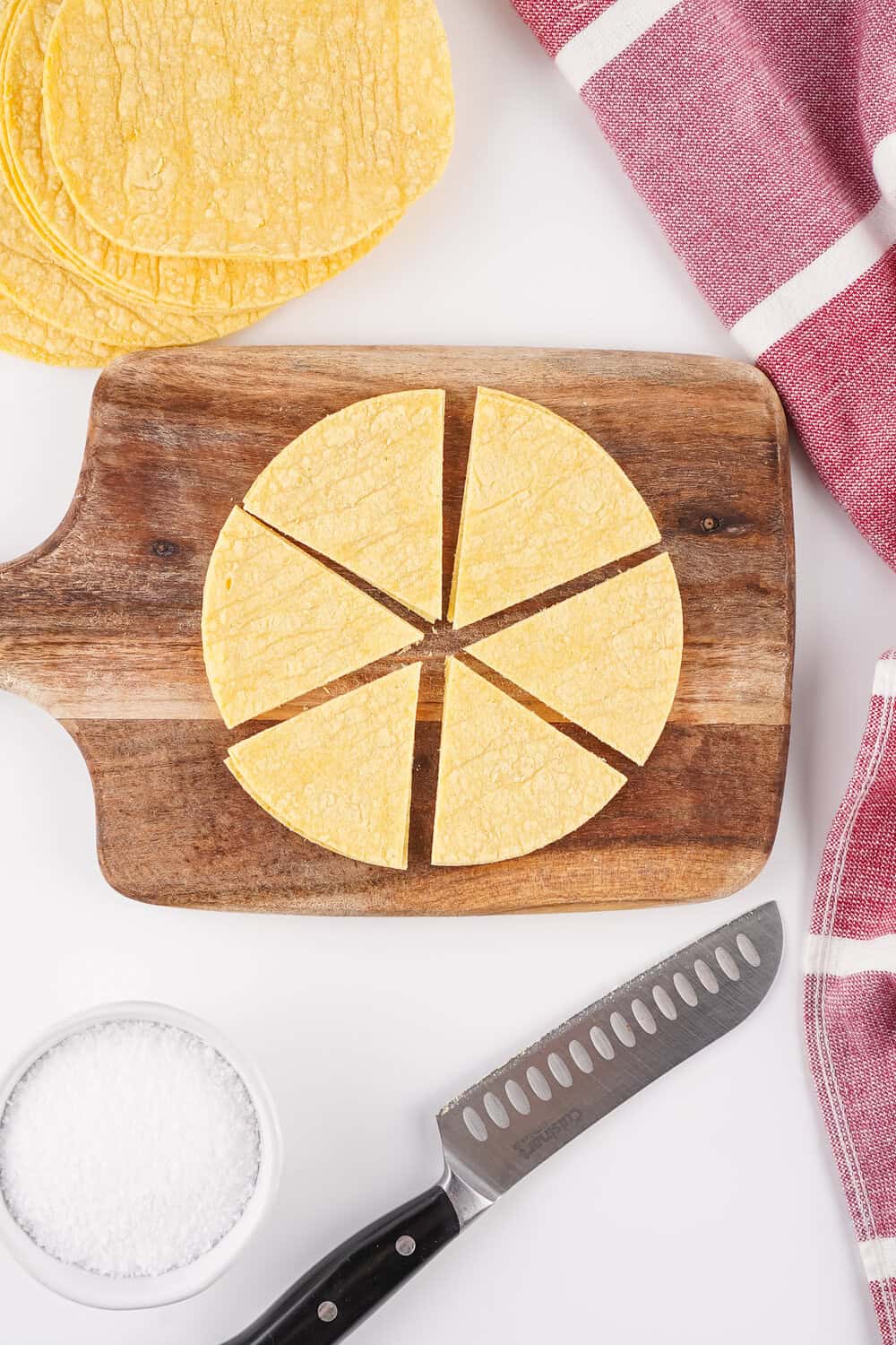 corn tortilla on cutting board cut like a pie